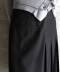 LAYERED PLEATED MIDI SKIRT