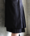 LAYERED PLEATED MIDI SKIRT